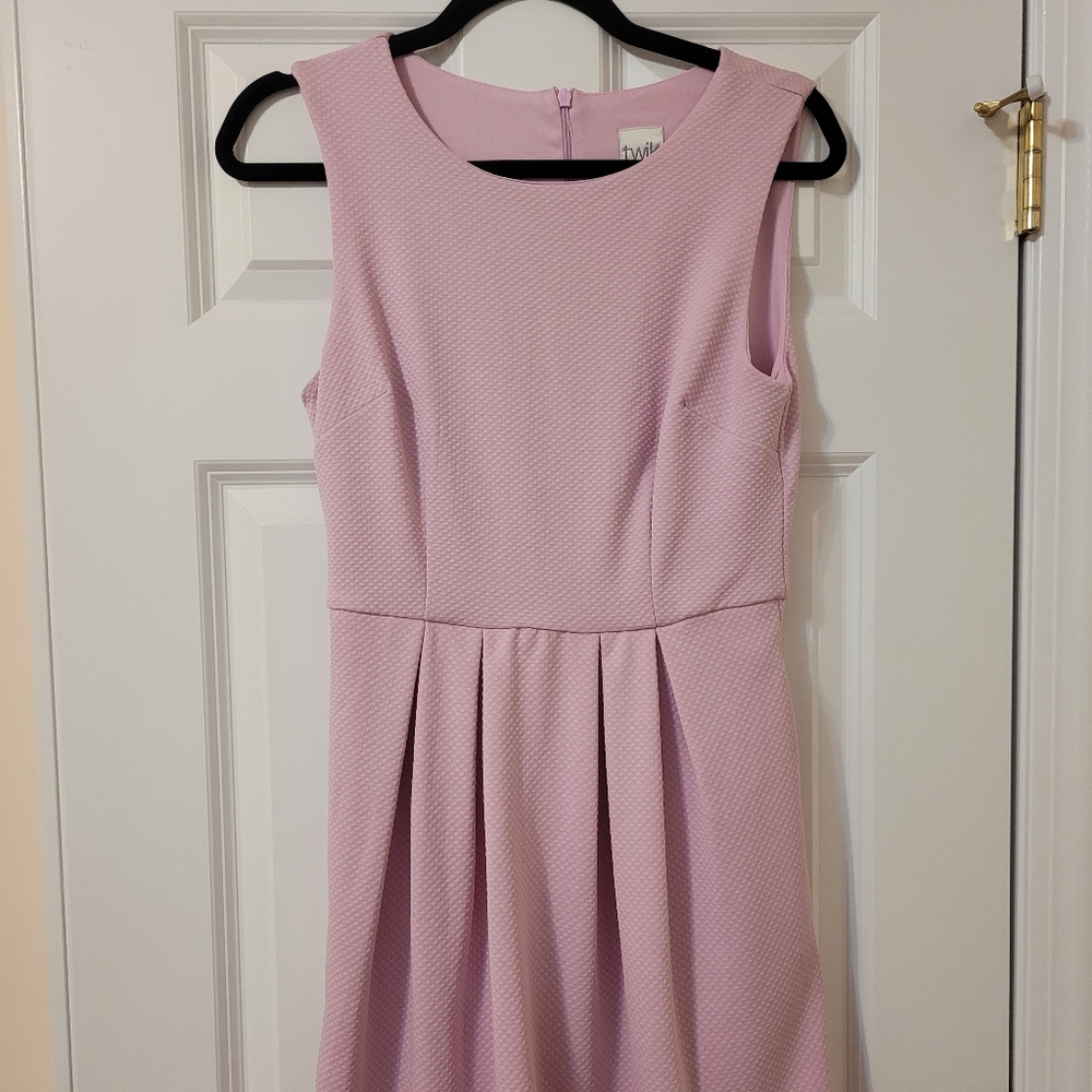 Twik pink dress with pockets.